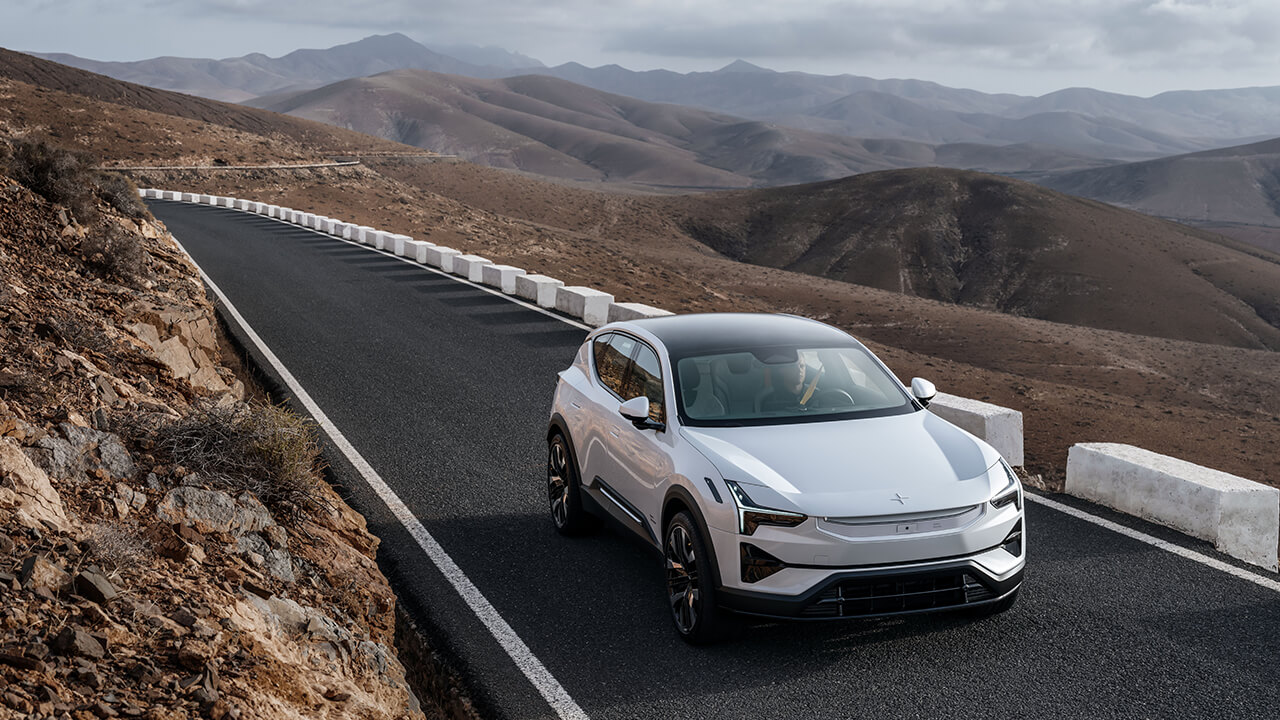 Polestar driving down mountainside road